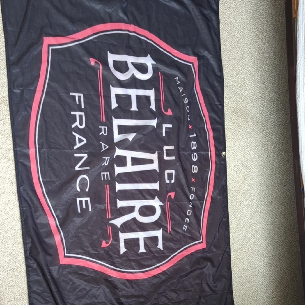 Luc Belaire Black and Red Banner